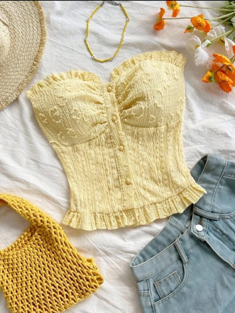Women's sleeveless crop top, bohemian style, with cutouts and buttons.